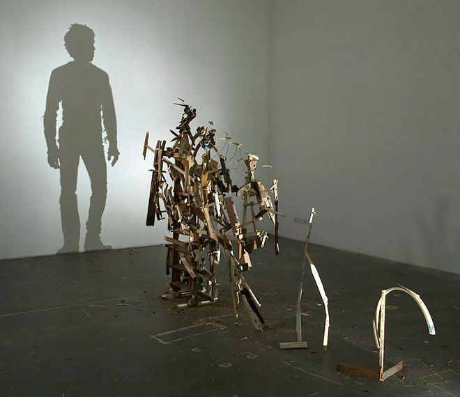 A collection of scrap metal in a surprising shape is creating the human-like shadow