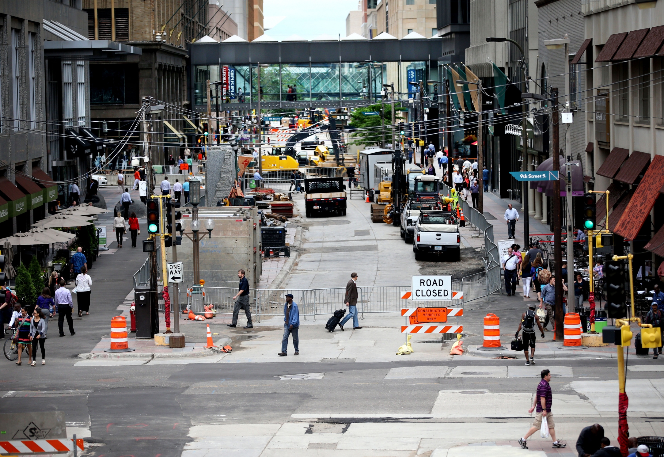 A photograph from the Target skyway of pedestrian crossing Nicollet Avenue near 8th street amidst construction.