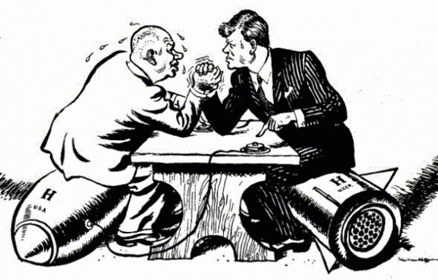 Cartoon of JFK and Khrushchev arm wrestling while sitting on top of missiles.